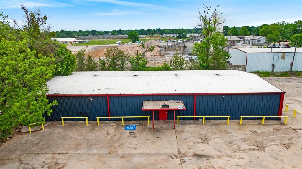 Located at 1734 N Main Street in Paris, TX, this 4,836 square foot metal building sits on approximately 0.945 acres and is conveniently located just one-half mile from Highway 271 North. Previously operated as a long-standing lounge and entertainment venue for 28 years, this property offers a turnkey opportunity for entertainment, restaurant, bar, or event use. Sale includes the business and Texas Liquor License to be transferred.

The interior is fully equipped with a wood dance floor, stage, stage lighting, stereo system throughout, customer-pay digital jukebox, 4 pool tables, shuffleboard, 2 TVs, and 27 tables with lounge seating. The spacious bar area includes bar stools, fully stocked liquor inventory, display coolers, beer coolers, soda gun, 2 ice wells, and a stocked walk-in beer cooler.

Additional equipment included with the sale consists of change machines, cigarette machine, ATM, washer and dryer, refrigerator, microwave, toaster oven, office furnishings, security camera system, and safe. The building also features designated men’s and women’s restrooms.

Outside, the property offers a large parking lot with steel parking bumpers and excellent accessibility from North Main Street. This property presents an excellent opportunity for someone looking to continue entertainment operations or repurpose the space for another commercial use. Seller also has MLS#21260974 available for sale.