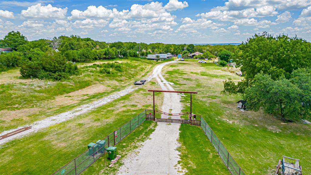 AG Exempt, Unincorporated land! Current real estate taxes are less than $3,000 a year. You heard me.....

19 Acres – Endless Possibilities in Azle ISD! No Restrictions! MOBILE HOMES OK! BANDOS- OK! DEVELOP THIS INTO A MOBILE HOME PARK! MAKE IT AN RV PARK! DREAM IT AND BUILD IT! COMMERCIAL - OK! BUY IT AND BUILD IT TODAY! Incredible opportunity to own 19+ peaceful, picturesque acres in Azle ISD with no restrictions! This stunning property offers privacy, natural beauty, and unmatched versatility — whether you're looking to build your dream home, start a commercial venture, develop a tiny home or RV park, or create a private retreat.
Enjoy star-filled skies, mature trees, and a serene setting with a large approximately 2-acre pond and seasonal creek. The land features multiple access points and extensive road frontage on Tenderfoot Trail — all outside the floodplain. Ideal for livestock, horses, farming, or multi use development: Main Features Include: Double-wide mobile home approximately 2,400 sq ft, with 3BR & 1BA, large living area with wood-burning stove, oversized kitchen, full laundry room, office, and covered porches, 42 solar panels, newer roof, central HVAC
Land includes 2 septic systems, 1 well, and 5 RV hookups. AG exemption on majority of the land, main house sits on 1 acre, not AG exempt
 Multiple outbuildings: metal garage with 3 roll-up doors & electric, 750 sq ft rental home, greenhouse, storage buildings. Horses and livestock permitted. No zoning or deed restrictions – perfect for commercial use, mobile home park, tiny home community, truck parking, or nonprofit retreat
Endless opportunities await on this rare, unrestricted property. Bring your imagination and make it your own! Multiple parcel IDs. All structures sold AS-IS, no warranties or representations. Owner is not interested in dividing the property. Any buyer will need to purchase first and then divide it after closing. No owner carry.