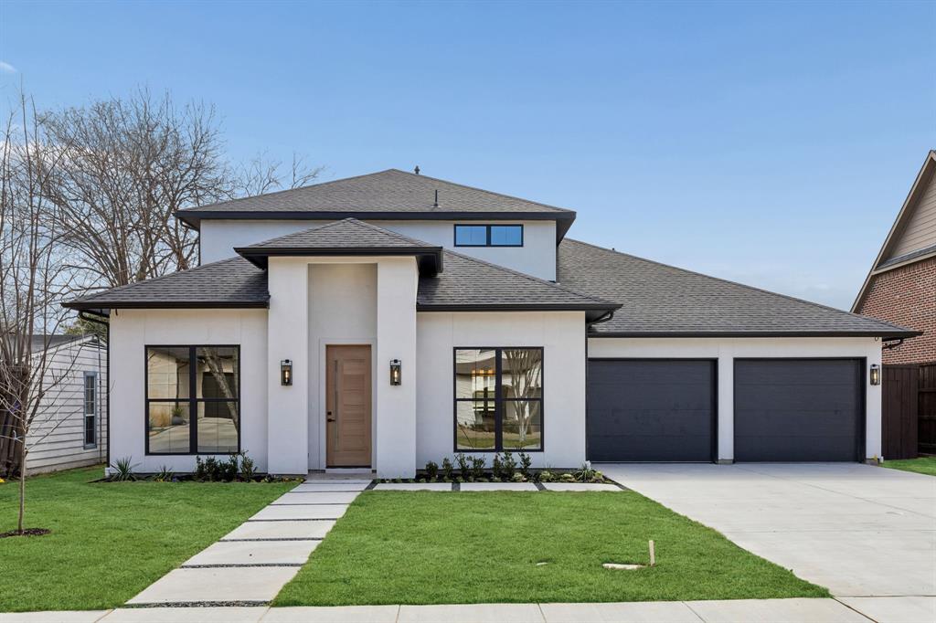 Just completed and truly move-in ready, this stunning new construction home was built from the ground up with exceptional craftsmanship, elevated finishes, and modern efficiency in mind. Every detail has been thoughtfully designed to deliver both luxury and livability. Striking stucco elevation paired with bold black-framed windows creates unforgettable curb appeal, while the front-facing two-car garage and clean architectural lines offer a sophisticated first impression. Inside, engineered hardwood flooring, solid core doors, and an abundance of natural light set the tone for the refined interior. A private first-floor study provides flexibility as a home office or additional bedroom. The expansive living room is anchored by a dramatic fireplace, creating a stunning focal point and inviting gathering space. Gourmet kitchen is exceptional, featuring a waterfall island, dual pendant lighting, slim shaker-style custom cabinetry, quartz countertops, and a walk-in pantry. Outfitted with ZLINE commercial-grade stainless steel appliances, a gas cooktop with pot filler, and designer Delta fixtures, this kitchen was designed to impress. A bright breakfast nook completes the space. The private primary suite is a serene retreat with vaulted ceilings and a spa-inspired bath showcasing a freestanding soaking tub, oversized walk-in shower and a custom WIC. A 1st floor guest suite with full bath offers ideal accommodations for visitors. Upstairs includes 2 additional bedrooms, a full bath & a spacious secondary living area perfect for a study space. The dedicated media room with wet bar makes entertaining effortless. Luxury meets functionality with a mudroom, a full-size utility room w-sink, epoxy garage floors, in-ground gutter drains, spray foam insulation + a tankless water heater. The home is pre-wired for speakers, cameras + high-speed internet, providing modern convenience throughout. The covered back patio overlooks the yard & offers the perfect setting for outdoor living.