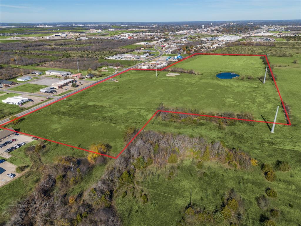 This 42.601 acre tract presents a prime development opportunity inside the Greenville city limits with scale, visibility, & flexibility that is increasingly rare in fast-growing North TX markets. With 1,178 feet of frontage, utilities available including water, sewer, & electric, & the ability to subdivide, this property is well positioned for a mixed-use concept that could include commercial, multi-family, single-family, or a thoughtfully planned combination.
The land has already been excavated, offering a head start for development, & currently benefits from a Commercial AG exemption. Location is a major differentiator. The property sits less than one mile from I-30 at Wesley Street, approximately 2.5 miles from FM 1570 & within 3 miles of major employers such as L3 Harris & Innovation First. TxDOT plans to widen Highway 34 & current traffic counts range between 23,000 & 25,000 vehicles per day, adding long-term visibility & accessibility upside.
Greenville is experiencing strong, measurable growth. Since 2020, the city has seen a population increase of over 15 percent, outpacing national growth rates, driven by affordability, business expansion, & regional migration from the Dallas metro. Within a two mile radius, approved plats & active developments account for more than 2,500 new homes, creating immediate demand for retail services, housing options, & supporting commercial uses.
Surrounding commercial activity continues to expand, reinforcing this corridor as a focal point for future growth. The site is well suited for a mixed-use or age-qualified residential concept paired with nearby retail & services, with zoning flexibility allowing multiple development paths.
For developers & investors seeking frontage, infrastructure, proven growth indicators, & entry into one of North Texas’s accelerating secondary markets, this property offers scale, timing, & optionality at an attractive price basis, representing one of the best opportunities on the market today.