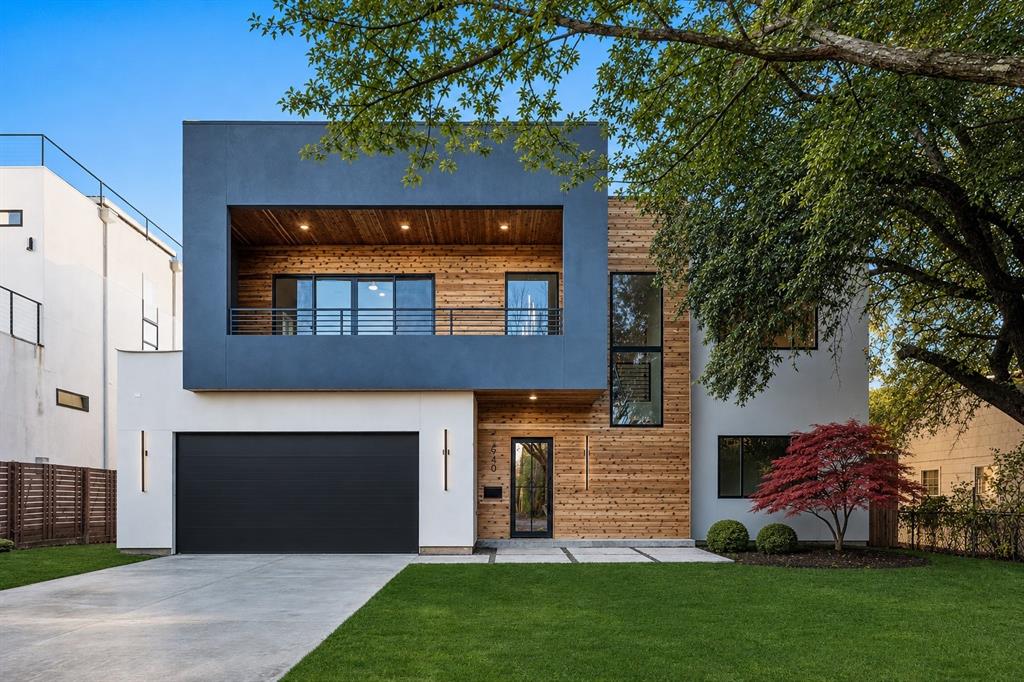 Stunning new modern construction in Bluffview, custom-designed by renowned architect Adriana Meyer of JADE. This thoughtfully curated home blends clean modern architecture with warm earth-tone materials, creating a tranquil, light-filled living environment with seamless indoor-outdoor flow.
Designed for modern living and entertaining, the home features walls of glass, hardwood floors, vaulted ceilings, and designer lighting throughout. Offering over 4,500 square feet, the flexible floor plan includes 5 bedrooms plus a private office. An upstairs game room anchors four secondary bedrooms, while the front bedroom opens to an oversized private covered patio with panoramic Bluffview views.
The dramatic living room showcases soaring vaulted ceilings, a fireplace, and a built-in coffee bar, opening directly to the outdoor patio. The gourmet kitchen is equipped with a stone island, custom wood cabinetry, stainless steel appliances, built-in refrigerator, gas range, hidden pantry, and wine bar—ideal for everyday living or hosting.
Outdoor living continues with a covered patio featuring a built-in outdoor kitchen, custom tile, and generous entertaining space. A low-maintenance backyard wraps around to the downstairs primary suite, offering privacy and connection to the outdoors.
The primary retreat features a spa-like en suite bath with multiple vanities, private wash closet, freestanding soaking tub, glass-enclosed shower, and a massive walk-in closet. Additional highlights include a large first-floor utility room with mudroom space, a two-car garage, and close proximity to shopping, dining, and the new Midway Manor Park with bike trails.
A rare opportunity to own a new construction modern home in Bluffview with exceptional design, outdoor living, and a true lock-and-leave lifestyle.