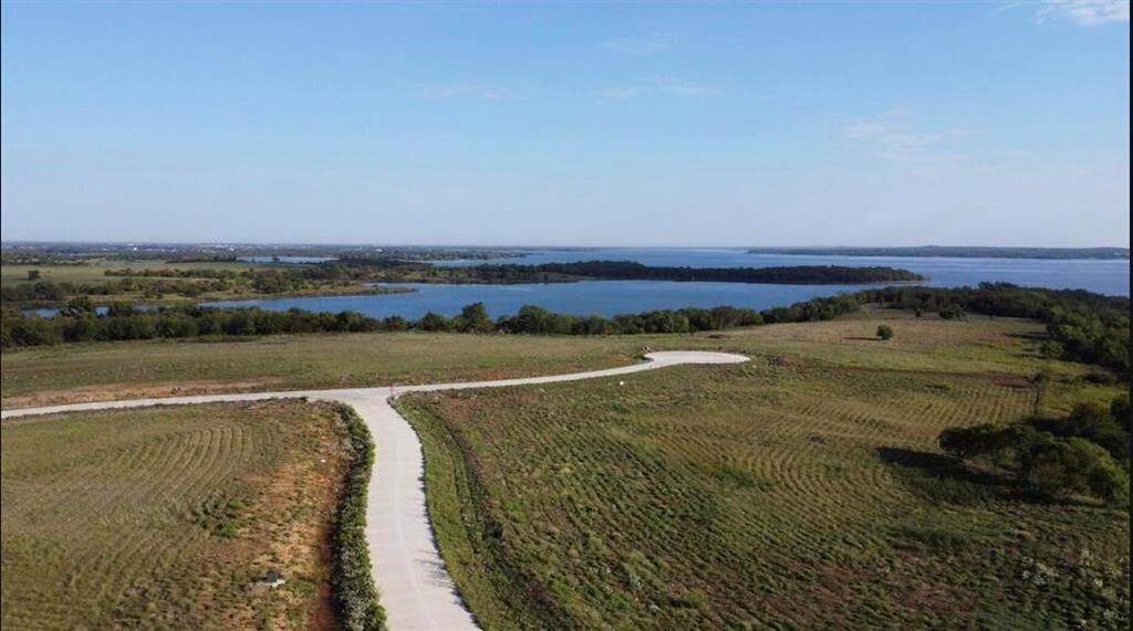 2 ACRE LOTS - GATED COMMUNITY - LAKE VIEWS - NEARBY MARINA & BOAT LAUNCHES - NO CITY TAXES. Palomino
 Bay contains 23 two-acre lots inside an exclusive gated community. Located along the shoreline of Lake Ray Roberts in
 Sanger, you are just across the street from the local marina and public boat launch! Come and pick out your custom
 homesite for your dream home before they are all sold! Lot 9 is on the largest peninsula on the property, which places you on a quiet culdesac with sweeping view of the lake! Could be combined with Lot 10 next door, for a 4-acre estate!