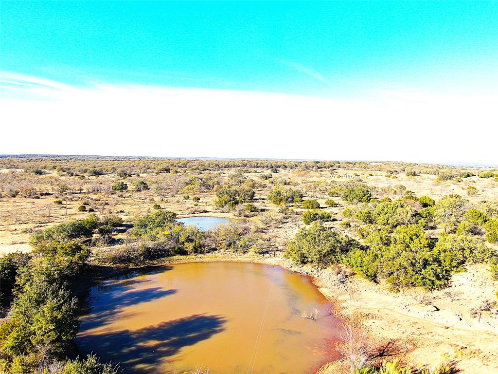 Come take a look at this 37.31-acre tract located on County Road 131 in Brown County. This property offers a great mix of open space and cover, making it ideal for livestock, hunting, or building your dream home in the country. The south boundary provides convenient county road frontage, and the property is fenced on all four sides with fair fencing currently holding livestock.
A large tank sits on the land, providing water for animals and wildlife, and there is plenty of natural cover to support deer, turkey, and other native species. Electricity and rural water are available at the road, giving you a head start on future improvements.
There is also a covered area perfect for parking tractors, equipment, or storing feed. Additional acreage adjoining this property on both sides may be available if you’re looking for even more land.

This is a great opportunity to own a versatile piece of Texas land—come see what it has to offer!