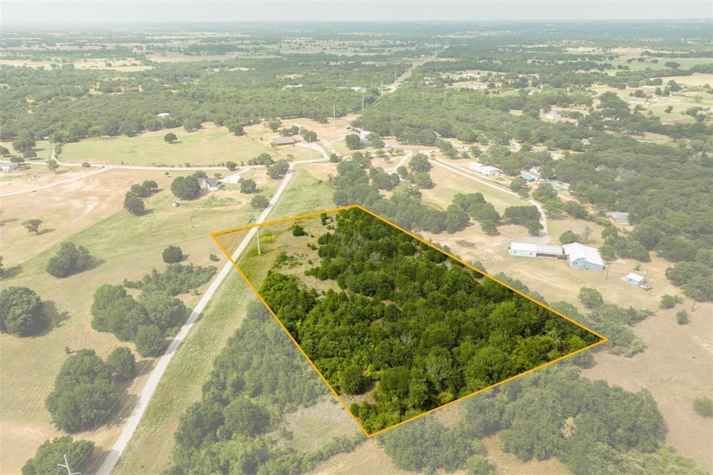Escape to your own 4.85-acre private sanctuary in the heart of Wise County. Tucked away on a quiet private road, this heavily wooded estate offers the ultimate blend of natural beauty and seclusion. Whether you're envisioning a custom-built dream home or a serene weekend getaway, the mature canopy of trees provides the perfect backdrop for a life lived outdoors. Enjoy the freedom of no HOA restrictions and the luxury of space, all while staying just 30 minutes from Fort Worth. Your piece of Texas paradise is waiting; secluded, spacious, and spectacular. No gates so you can drive by and check this one out at anytime.