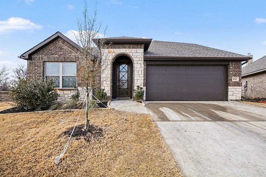 Built in 2024, this highly upgraded home offers 5 bedrooms. A flexible 5th bedroom ideal for a home office, plus a game room. Three bedrooms at the front of the home with a full hallway bath. Luxury plank flooring flows throughout the main living areas with carpet in the bedrooms. The spacious kitchen featuring gray-brown cabinetry, granite slab countertops, includes a refrigerator, gas stove with gorgeous backsplash, microwave, dishwasher, disposal, walk-in pantry and island with bar seating. The eat-in kitchen features an L-shaped bay seating area that creates separation from the living room. The primary suite accommodates a California king and the ensuite has a glass shower, dual sinks, and a large walk-in closet with extra shelving and hanging space. Upstairs is the game room, 5th bedroom, full bath, and linen closet. Additional highlights include a 2-car garage, with a coat rack on entry by the utility room, tankless water heater, dual HVAC units, and a nice backyard.
