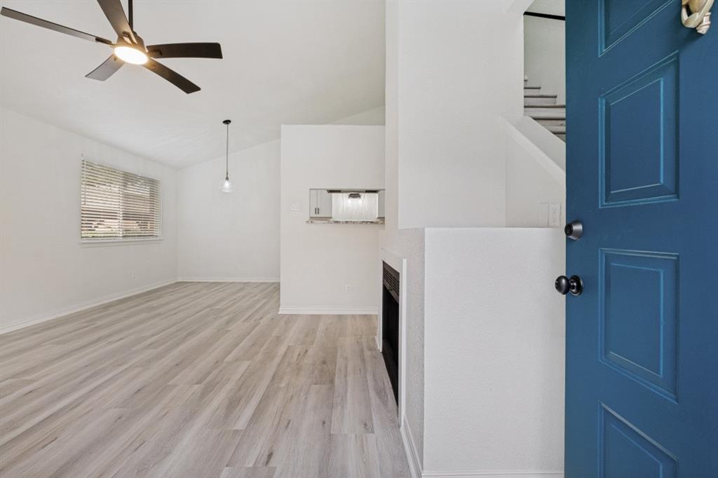 Completely and fabulously remodeled two bedroom condo. Beautiful luxury vinyl plank flooring throughout, including the stairway - no carpet whatsoever. White shaker, soft close, all wood cabinetry and elegant granite create a kitchen to die for. Generous laundry room has opposing spaces for full size washer and dryer with shelving. Both bedrooms have attached baths with new tubs, on trend tile, and very cool vanities and lighting. Wood burning fireplace in living room is a great bonus. Fenced patio with locking gate encompasses front door to give extra privacy and security. Location within the complex is also great. The unit is close to one of the Tarpley Road entrances, the mailboxes and the front pool. A beautiful unit in an amazing location!