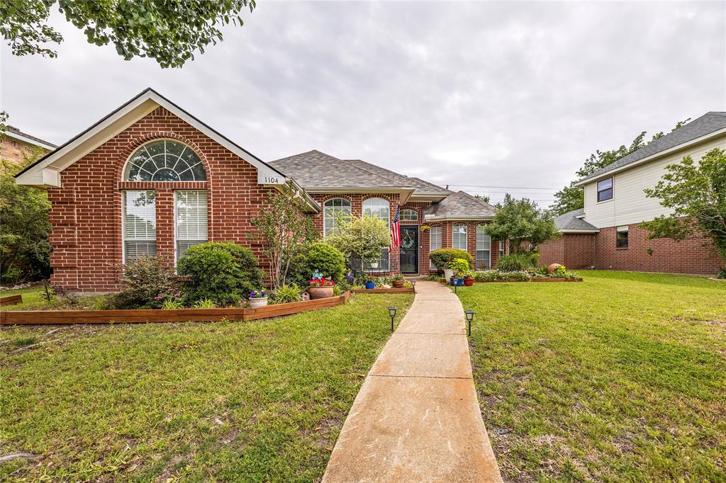 Updated 3-bedroom, 2-bathroom brick home in the Wyndham Estates subdivision in Wylie, Texas with no HOA and no MUD tax. From the moment you pull into the rear-entry 2-car garage and walk through the door, this 1,512-square-foot traditional feels like a place where real life happens comfortably.
The open-concept living room draws you in with vaulted ceilings, engineered hardwood floors, a wood plank accent wall and a wood-burning fireplace that anchors the space on cool evenings. The renovated eat-in kitchen is the kind you actually want to cook in gray shaker cabinets, butcher block countertops, a farmhouse sink, subway tile backsplash and stainless steel appliances, all opening to a dining room and a flexible game room where the layout naturally pulls people together.
Mornings feel easy in the primary suite with its private bath, dual vanities, walk-in shower, and soaking tub. Two additional bedrooms share an updated hall bath and a dedicated laundry room with full-size washer and dryer hookups keeps the everyday routine running smoothly.
Step outside and the wood-fenced backyard and covered back patio give you a private outdoor space that feels like an extension of the home, quiet enough to unwind, spacious enough to entertain. Located in Wyndham Estates in Wylie, TX 75098, with quick access to Highway 78, FM 544, and everyday conveniences just minutes away.