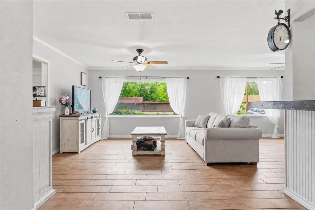 Beautifully remodeled 3-bedroom, 2-bath brick home situated on an oversized lot in sought-after Westwood ISD! From the moment you step inside, you’ll love the inviting entry that opens into a bright, open-concept living, dining, and kitchen area perfect for gathering and entertaining. The expansive breakfast bar creates a natural centerpiece for hosting family and friends.
The spacious living room is filled with natural light from large picture windows, complemented by stylish wood-look tile flooring throughout the main areas, new flooring in all the bedrooms. The primary suite offers a relaxing retreat with a walk-in closet and a beautifully updated en-suite bathroom.
The functional layout includes a separate utility room just off the kitchen, complete with extra storage and pantry space. Step outside through elegant French doors to enjoy a fantastic outdoor living area featuring a covered patio, fenced backyard, attached garage with an attached workshop—ideal for hobbies or additional storage.
This move-in ready home truly has it all—space, style, and functionality. Don’t miss your chance to make it yours!