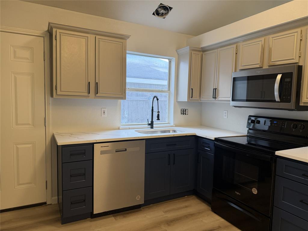 MOVE IN READY, Fully updated with 3 bedrooms, two baths, new paint, new roof, new floor, new kitchen and bathrooms.
