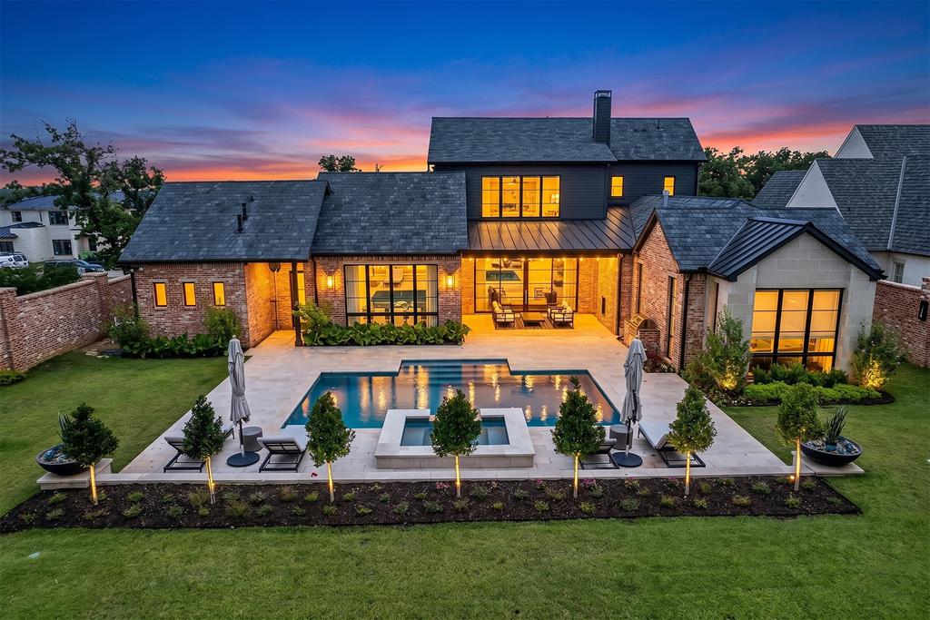 Nestled in the gated community of Stoney Brook, this exceptional residence at 2500 Park Grove Loop blends luxury, comfort, and thoughtful design throughout. Built for entertaining, the home features expansive open-concept living spaces, elegant finishes, and seamless indoor-outdoor flow.

The chef’s kitchen is complemented by a fully equipped prep kitchen, while imported tile from Mexico and three fireplaces add warmth and sophistication throughout the home. Double doors lead into the private primary suite featuring an electric fireplace, spa-inspired bath with abundant storage, a built-in towel warmer, and stunning gold finishes.

Designed with versatility in mind, the layout offers two bedrooms downstairs and two upstairs, along with a dedicated office with custom built-ins, a workout room with filtered water access, and a large game room complete with built-ins and a beverage refrigerator. Every walk-in closet includes custom built-ins, and a separate communication room is tucked discreetly at the back of the home.

Additional highlights include 4 full baths and 3 half baths, a wine room, and both a 2-car epoxy garage plus a separate 1-car epoxy garage.

Step outside to your private backyard retreat featuring a chlorine-heated pool and spa by Klaerner Pools, elegant travertine tile decking, and a brick privacy wall creating the ultimate outdoor oasis.