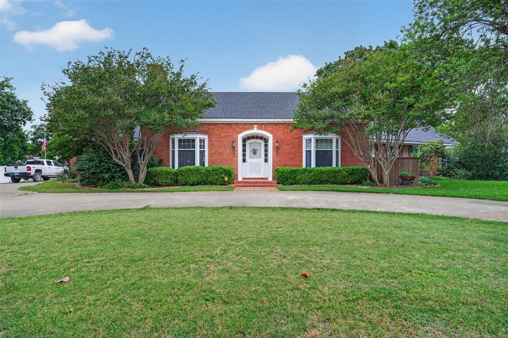 This exceptional single-story Colonial Revival home reflects a level of care and craftsmanship rarely found today. Offering 3,588 square feet, 3 bedrooms, and 3.5 baths, the property blends historic character with thoughtful modern updates. Inside, the dining room showcases timeless artistry, while two wood-burning fireplaces add warmth and charm to the living and dining areas. Concealed media compartments preserve the home’s clean aesthetic, and custom-built-in storage enhances functionality throughout. Original wood flooring provides a meaningful connection to the home’s heritage. The spacious kitchen is designed for both entertaining and everyday living, featuring a large center island, double sinks, double ovens, a warming drawer, and a stunning walk-in pantry with a glass door. Nearby, the utility room adds convenience with an additional sink and expansive counter space. Major system upgrades provide peace of mind, including completely updated electrical wiring and panels, two regularly serviced Trane HVAC units with a smart thermostat, a roof approximately six years old, new gutters, new carpet in the addition, and a whole-house water filtration system. The original primary suite offers generous proportions and timeless appeal, while the oversized secondary suite with walk-in closets provides flexibility for guests, multigenerational living, or a sophisticated home office. Custom millwork in the primary bath adds a refined finishing touch. Outside, the grounds create a private retreat centered around magnificent oak trees. Mature landscaping and established blackberry bushes enhance the setting, while the resurfaced inground pool features a new pump and filter system, plus a slide and diving board for entertaining. Additional amenities include RV storage, double-gate access from both the street and rear street, and a two-car garage with its own half bath.