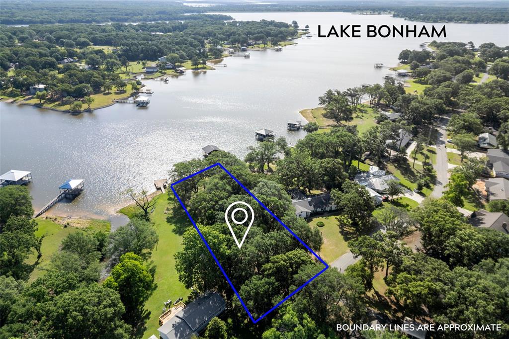 RARE OPPORTUNITY!  Beautiful 0.781 ACRE WATERFRONT lot on the COVETED Beavers Point Peninsula! Lots of MATURE TREES to frame your WATERFRONT VIEW! Lake Bonham is perfect for fishing, water skiing, boating, tubing and jet skiing! Just 1 hour North of DFW. PERFECT OPPORTUNITY for you to LIVE THE LAKE LIFE! See survey in MLS back docs and in photos and MLS documents for Beavers Point addition building requirements and Lake Bonham rules. Minimum 1,000 Sq ft living area - excluding porches, patios, and garages. Minimum one-car garage. No manufactured or mobile homes. Great Q and A for questions etc. available in MLS about the lots and Lake Bonham. Don't miss out on your chance to BUILD YOUR DREAM LAKE HOUSE ON THE WATER! - No build time requirement! Lean to shed on the property for great storage. It's time for YOU to WAKE AT THE LAKE! See virtual rendering image of potential boat dock. Please note: See survey in MLS docs for final boundary lines - some online services show incorrect aerial boundary lines. Property used to be a double lot and was subdivided by the previous owner before both lots were sold.