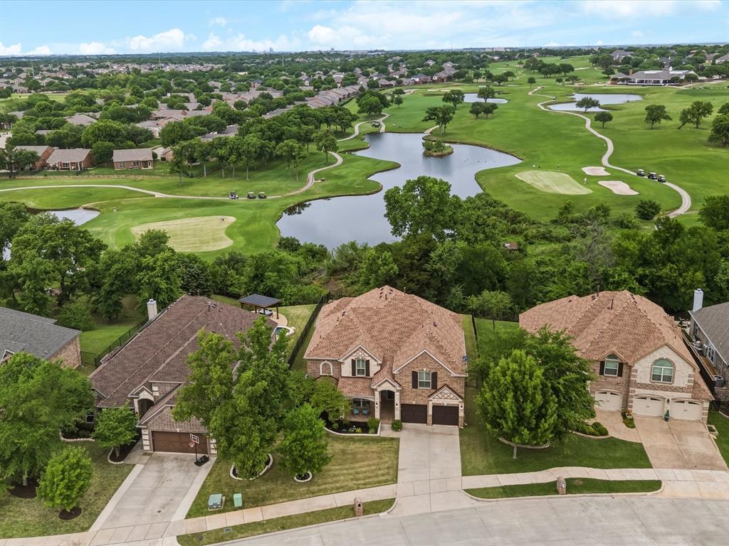 Don’t miss this rare opportunity to own one of Oakmont’s most coveted views - an elevated, panoramic vantage point overlooking the water and the signature 18th hole. Homes with this kind of setting simply don’t come available often. Soaring vaulted ceilings, arched entryways, intricate woodwork, crown molding, and tall baseboards complement the rich wood flooring throughout, all illuminated by natural light pouring through large windows with plantation shutters. Fresh interior and exterior paint, colorful landscaping, and beautifully curated furnishings (all negotiable) create a turnkey experience. Major updates include a new roof (2025) and new AC units (2025–2026) offering peace of mind for years to come. The main floor features the primary suite, a dedicated office, and two full baths. Upstairs you’ll find four spacious bedrooms, a game room loft with views to below, and two additional full baths. HOA dues are under $60 per month in this exclusive community, with golf membership optional. Virtual tour and property website available, call listing agent for links. Mere minutes from highly-rated Hawk Elem, Crownover Mid and Guyer HS.
