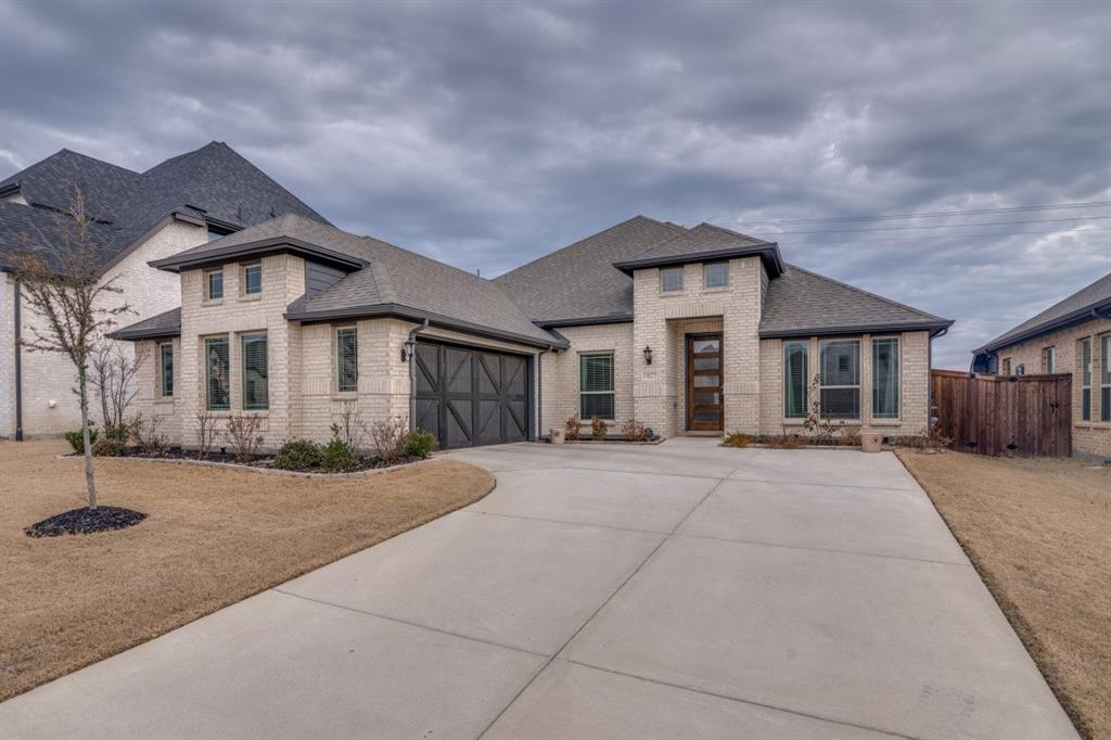 Built less than two years ago and loaded with thoughtful upgrades, this beautifully maintained 4-bedroom, 3-bath home in the sought-after Sonoma Verde community offers one of the best values in Rockwall County. With 2,253 square feet of well-designed living space, the open-concept layout features luxury vinyl plank flooring, a striking stone fireplace, and seamless flow ideal for both entertaining and everyday living. The island kitchen is equipped with granite countertops, a gas cooktop, built-in oven, and generous prep space, making it as functional as it is stylish. The private primary suite serves as a relaxing retreat with dual vanities, a seamless glass walk-in shower, and an oversized walk-in closet, while a separate fourth bedroom with its own en-suite bath and dual closets provides excellent flexibility for guests, multi-generational living, or a home office. Step outside to a covered patio overlooking a fully fenced, oversized backyard that backs to a peaceful greenbelt, offering beautiful sunrise and sunset views and a true sense of privacy. Located just minutes from Lake Ray Hubbard and The Harbor at Rockwall, you’ll enjoy easy access to dining, shopping, and recreation, all while living in a vibrant community known for its amenities, neighborhood events, and welcoming atmosphere.