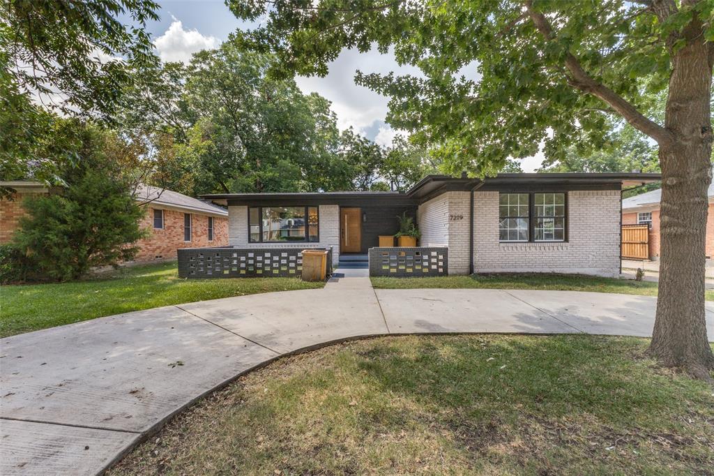 Nicely remodeled MCM home with expanded open living spaces and lots of natural light.  Centrally located near White Rock Lake and within the Lakewood Elementary school area this home features luxury vinyl flooring, newer windows, an updated kitchen with farm style SS sink, a large natural stone topped island, built-in refrigerator and lots of storage.  Large primary bedroom with dual sinks, quartz countertops and shower.  The secondary bedrooms are spacious and have great closet space.  There is also an office space perfect for working from home.  Spacious backyard with a wooden deck, 2 car rear entry carport and storage area, plus a front circular drive.