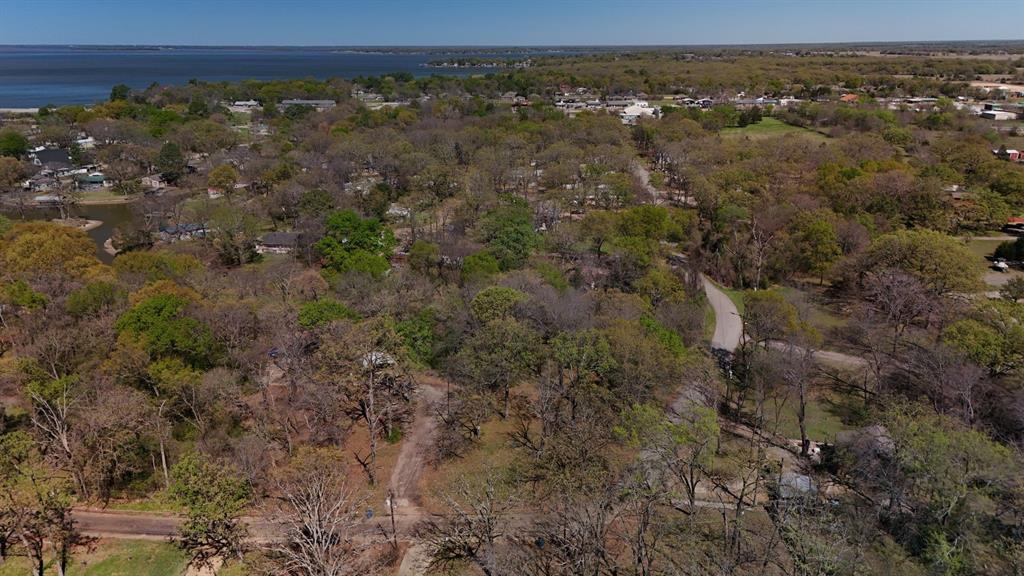 Discover the potential of this well-located property within the city limits of Gun Barrel City. Zoned R-3 residential, this lot offers flexibility for a variety of residential uses. There are no deed restrictions, and while HOA restrictions date back to 1964, it appears the HOA is no longer active, giving you added freedom. Public water and sewer are available, with electricity conveniently located at the street, making development easier and more cost-effective.

Enjoy quick access to local favorites like Tom Finley Park and Cedar Creek Reservoir, perfect for boating, fishing, and outdoor recreation. Just minutes from downtown Gun Barrel City for shopping, dining, and daily necessities, and only about 60 minutes from Dallas, this property blends small-town living with easy access to big-city amenities.