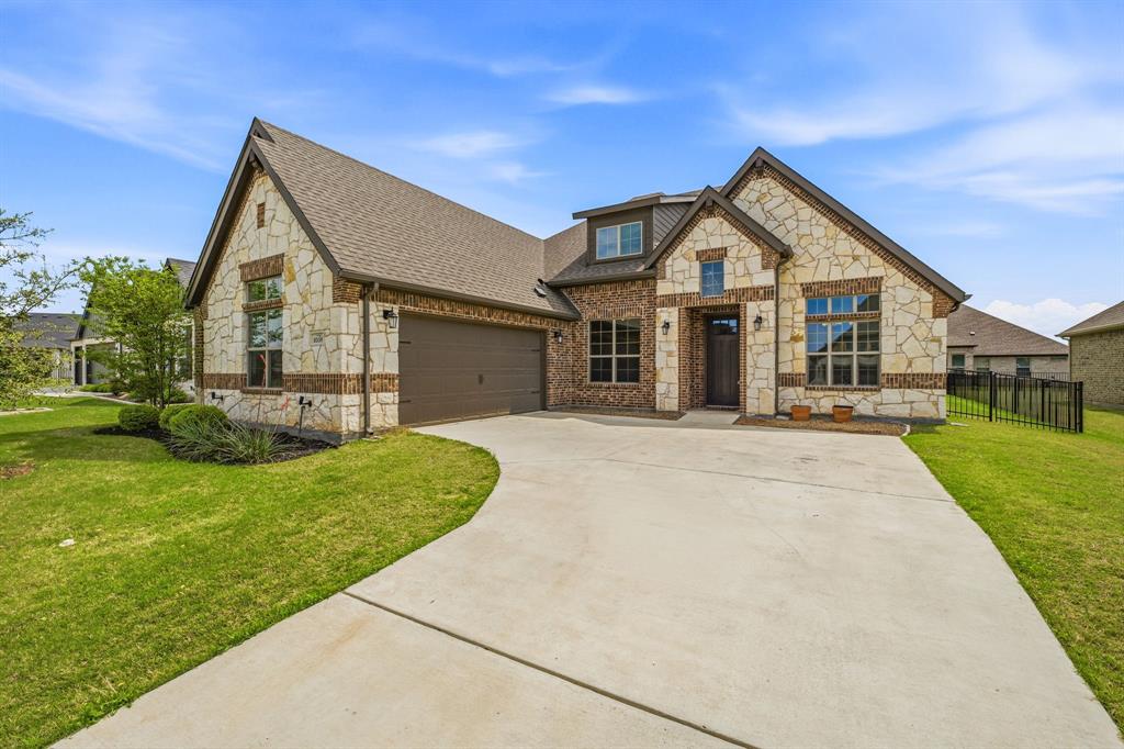 Welcome to this stylish, well-built home in Harbor Lakes. Just a couple of years old, it’s been lightly lived in and still feels fresh. You’ll love the open layout, tall ceilings, and the way the living, kitchen, and dining areas all flow together—it’s perfect for both everyday living and having people over.

The kitchen is a standout with a large island, gas cooktop, and clean quartz countertops. The primary suite gives you some space to relax, with a big soaking tub, walk-in shower, and a closet that can actually handle a full wardrobe. On the other side of the house, you've got three more bedrooms and a full bath with double sinks.

Out back, the fenced yard is easy to maintain and offers some space to unwind. You're tucked inside one of Granbury’s premier golf course communities, just minutes from the lake, downtown, and everything else the area has to offer.

If you’re looking for something that’s move-in ready and well taken care of, this is worth a look.