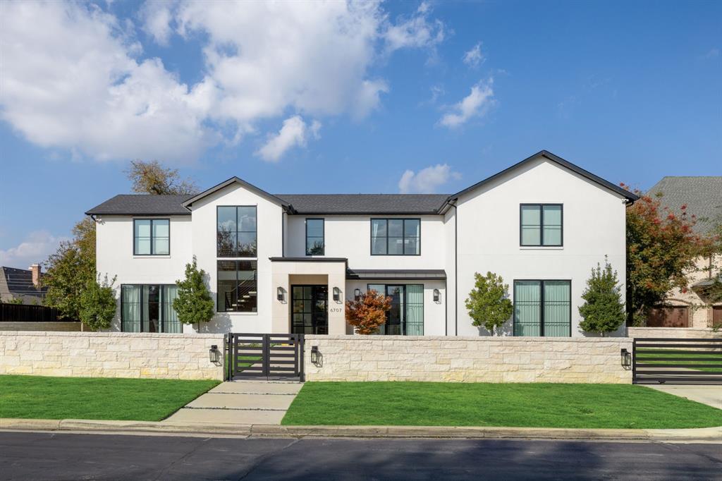 Experience sophisticated living in this exceptional Preston Hollow residence, set on an expansive 100x165 lot. Designed for both style and function, the open-concept floor plan is highlighted by expansive windows, high-end finishes, custom window coverings, designer fixtures and stunning hardwood and marble floors. The main level showcases a stunning  two-island kitchen complete with a Sub-Zero refrigerator, Wolf range, and prep kitchen, all flowing seamlessly into the formal dining room. A spacious living room with a striking see-through fireplace creates an inviting focal point. The oversized primary suite offers a private sitting area and fireplace, along with a luxurious ensuite bath with dual vanities, a walk-in shower, garden tub, and an impressive walk-in closet. A breakfast area with a dry bar and wine fridge, private office, powder bath, and laundry room complete the first floor. Upstairs, four generously sized secondary bedrooms, each with ensuite baths and walk-in closets, are accompanied by a media room and an additional utility room. Outside, the beautifully designed backyard is ideal for entertaining and everyday living, featuring a sparkling pool, covered patio and cabana, a full pool bath, turfed play area and a built-in grill. Additional highlights include a four-car garage with ample storage, gated front driveway, custom Savant-powered smart home and multimedia system, theater-quality surround sound systems, interior and exterior Nest cameras throughout, and fully integrated lighting and thermostat controls. Ideally located within walking distance to shopping and dining at Preston Royal Shopping Center, this one-of-a-kind home offers the very best of Preston Hollow living.