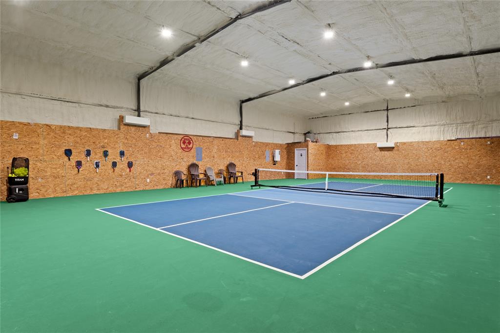 Located on 6.238 acres in the highly sought after Crawford School District, this custom built property offers the space, functionality, and amenities that are hard to find. Highlights include an approximately 3,000 (plus) sqft air conditioned pickleball barn that could also function as a basketball court, workshop, gym, or entertainment space, RV hookups, solar-powered shed or storage space, large screened in porch, wrought iron fenced backyard, and gorgeous sunset views nightly.
The 5 bedroom, 3 bathroom home features designer touches throughout, soaring 12 foot ceilings in the main living areas, and 10 foot ceilings in select additional spaces. The spacious floorplan offers large walk-in closets, abundant storage, and a functional laundry or mudroom complete with a built in dog wash station.
The oversized 3 car garage includes extensive attic storage, while the recently planted 13 wax myrtles will continue to grow and enhance the property’s privacy. Enjoy peaceful country living with the convenience of a quick drive into Waco.