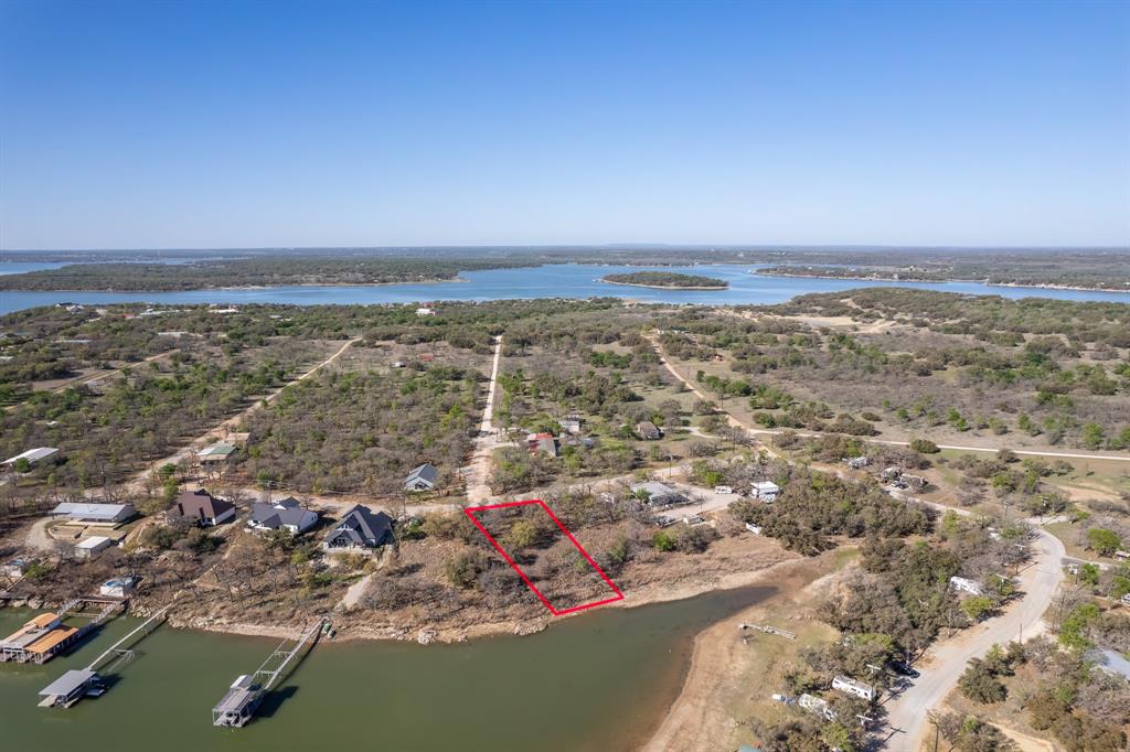 For sale: a beautiful waterfront lake lot, just over half an acre, ready for your dream home. This lot is located in a gated community that offers great amenities like private swimming areas and boat ramps. You’ll enjoy plenty of wildlife around, making it a peaceful place to live. The quiet surroundings provide a perfect escape from the busy world. Build your perfect retreat where you can relax and enjoy the beauty of nature every day. Don’t miss this great opportunity!