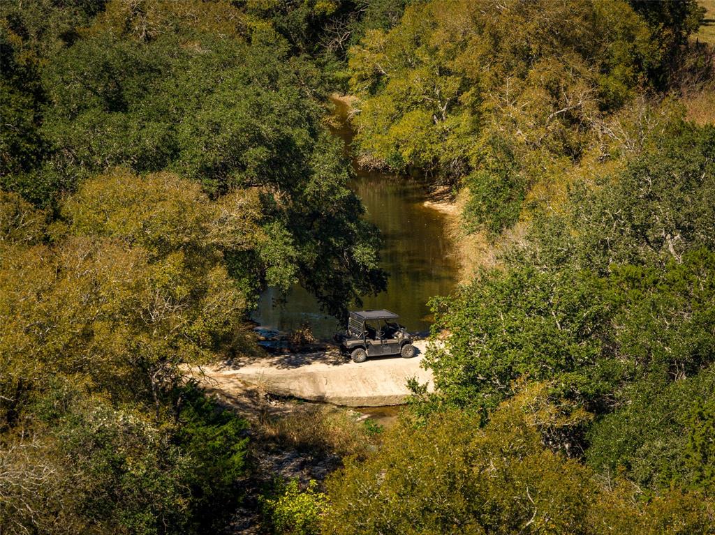 Located in the heart of Texas and overlooking the breathtaking Brazos River Valley, the ranch offers a truly unique opportunity to own a property rich in history and natural beauty. Once home to two neighboring camps—Buffalo Ridge, a cowboy camp for kids, and Prairie Valley Presbyterian Church Camp—the ranch carries with it generations of stories and memories.

The current owners thoughtfully combined the properties and beautifully remodeled several of the original buildings, creating a warm and inviting retreat for family gatherings and entertaining friends. The ranch offers some of the most incredible views in the area extending out for miles. Featuring an excellent mix of open pasture land (much of which is in costal hay production) and heavily wooded areas ideal for wildlife habitat. Enjoy traversing along the banks of the creek under beautiful oak tree canopies, or winding through one of the many trails and seeing all this property has to offer.

The property’s most remarkable natural feature is, of course, Iron Creek. With over 4,225 feet of frontage on both sides, this spring-fed creek provides a reliable year-round water source for livestock and wildlife alike. See Document section for full description and aerial.