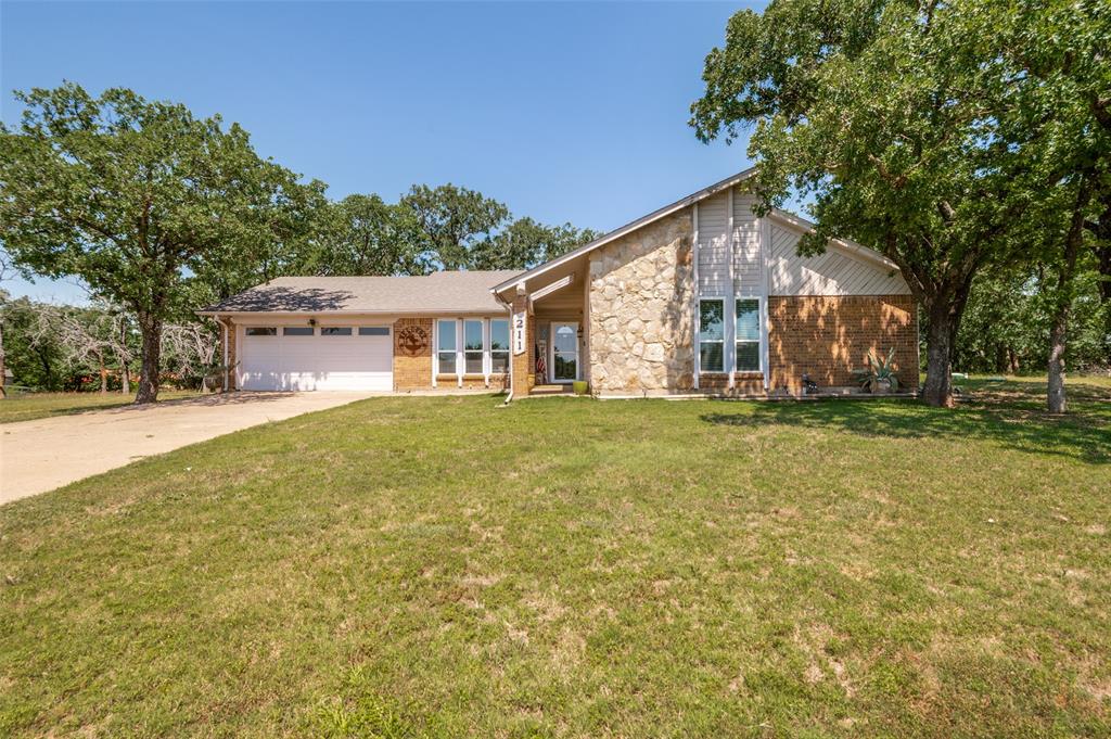 Nestled on a spacious half-acre lot, this charming 3-bedroom, 2-bathroom home offers the perfect blend of comfort, privacy, and outdoor space. Surrounded by mature trees and lush landscaping, the property provides a peaceful retreat while still being conveniently close to local amenities.
Inside, the home features a bright and open floor plan with abundant natural light and a welcoming living area with wood burning fireplace. A well-appointed kitchen comes complete with ample cabinet space, granite counter tops, modern appliances and breakfast nook. A flex room offers an option for extra dining, living or office space. The primary suite includes an en suite bathroom, beautiful updated walk in shower and generous closet space, while the two additional bedrooms are ideal for family, guests, or a home office. Step outside to enjoy the expansive backyard, it is perfect for entertaining, gardening, or simply relaxing under the open sky. With plenty of room for outdoor activities, future additions, or even a workshop or pool, this property offers endless possibilities. Whether you're looking for a quiet place to call home or extra space to spread out, this beautiful half-acre property combines country-style living with everyday convenience.