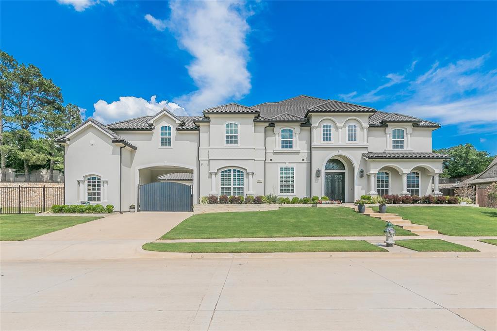 Luxurious 6 bedroom 7.5 bath contemporary home located on a low traffic cul de sac in Southlake Meadows. Lavish pool and spa with fire features and lights that dance to music! Just shy of an acre with wow factor up lighting across entire back wall. Intimate sunken fire pit, terrace garden and huge side yard. Covered outdoor living perfect for entertaining with gas grill, side burner, refrigerator and bartending sink. Gourmet kitchen offers oversized island overlooking main living area. Stainless steel Jenn-Air appliances, double ovens and walk-in pantry. Master offers dual closets, double vanity, 6ft jetted tub and a breathtaking dual entry shower containing 2 shower heads. Private office. Large game room. Designer finishes and touches throughout. Second master upstairs with large walk-in closet. All secondary bedrooms are spacious and have ensuite bathrooms. 3 car garage, pool shed, electric gated auto court and prewired security cameras. Carroll ISD and easy access to Hwy 114.