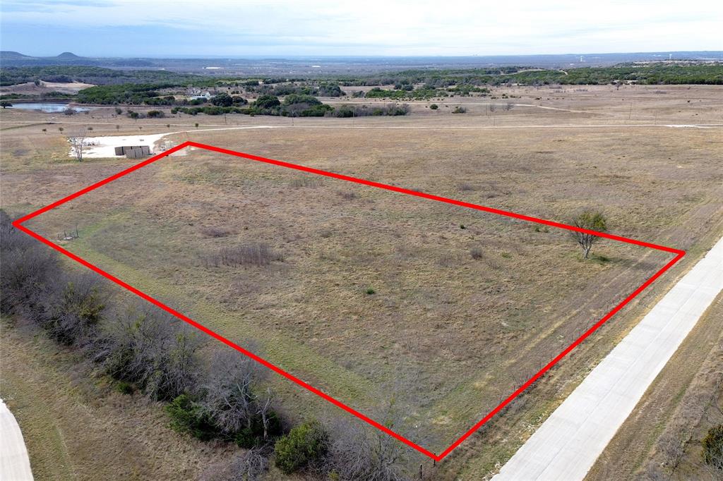 Welcome to an exceptional opportunity in Martin Creek! A rare, turnkey site for your dream estate. Nestled within a gated, 26-lot community with concrete roads and underground utilities, this offering rises above the ordinary! Approx. 5 acres of premium, unimproved land. Gently rolling terrain with gorgeous elevations, mature trees, and sweeping views! Rustic, elegant, gated entrance and a cohesive streetscape that sets a distinguished tone. Community amenities of a 10-acre common park, 3+ acre lake ideal for fishing or relaxing vistas. No build-time restrictions — you may build now or preserve this parcel for future development. Bring your own builder or coordinate with the developer for home plans and guidance. Owner financing is available! Flexible terms can help you claim this rare estate opportunity! Partial fencing. This isn’t just acreages. Its estate canvas in a thoughtfully designed, high-end neighborhood. With its private lake, scenic topography, gated entrance, and no hurry to build, this parcel allows you to create a legacy property at your pace. The amenity-rich common area and limited lots ensure both exclusivity and community appeal! PREFERRED LENDER INCENTIVES AND OWNER FINANCING AVAILABLE!