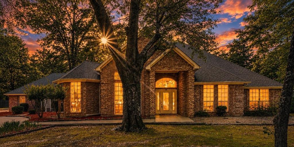 Nestled on 2.5 beautifully maintained acres just outside of Paris, Texas, in the desirable Beaver Creek Subdivision, this exceptional property offers the perfect blend of space, comfort, and privacy in sought-after North Lamar ISD. Impeccably maintained and move-in ready, this 4-bedroom, 3-bath home was thoughtfully designed with both everyday living and entertaining in mind.

Inside, you’ll find a desirable split-bedroom arrangement offering privacy and functionality for a growing or multi-generational family. The heart of the home is a spectacular kitchen featuring abundant workspace, beautiful custom cabinetry, and seamless flow into both the breakfast area and formal dining room—perfect for everything from busy mornings to holiday gatherings. Custom cabinets throughout the home add warmth, character, and exceptional storage.

Multiple living spaces provide room for everyone to spread out and enjoy, including a welcoming main living area anchored by a beautiful fireplace with custom built-ins, a cozy den, bright sunroom, and a convenient dry bar ideal for entertaining. A spacious utility room adds everyday convenience and functionality, while large windows throughout invite natural light and showcase the peaceful, secluded setting.

Step outside and enjoy the serenity of your expansive yard, offering room to roam, play, garden, or simply relax and enjoy country living with the convenience of town nearby. In addition to the attached 2-car garage, the detached garage features a workbench, dedicated office space, and private yard entrance—making it ideal for hobbies, projects, a home business, workout space, or guest overflow.

Located in a superb location with easy access to Paris while enjoying the quiet charm of Beaver Creek, this lovingly cared-for home offers the space, flexibility, and timeless quality today’s families are searching for. Volunteer HOA.