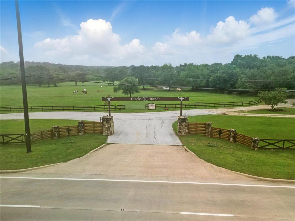 Iconic Ranch Estate in Flower Mound – Nearly 42 Acres of Opportunity!
Welcome to Circle R Ranch, a truly unique commercial estate set on 41.989 acres in the heart of Flower Mound. Perfectly positioned at the corner of Cross Timbers Road and Scenic Drive, this expansive property combines rustic charm with versatile functionality in a serene, tree-lined setting.

Currently operating as a private event venue, the ranch features a spacious building with an event-ready interior and a commercial-grade kitchen, ideal for hosting gatherings, retreats, or weddings. Additional outbuildings, an arena, and wide-open pastureland offer flexibility for a variety of uses — and livestock is permitted, adding to its ranch appeal.

With excellent visibility, multiple access points, and a peaceful countryside feel just minutes from town conveniences, Circle R Ranch presents an extraordinary opportunity to continue its legacy or bring your own vision to life.