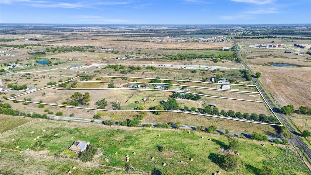 Prime Development Opportunity Just North of Downtown Celina. Located just north of Downtown Celina, this property presents an exceptional opportunity for development in one of the fastest-growing areas in North Texas. Situated along North Louisiana Street, just north of the future O’Brien Parkway intersection, the site offers excellent access and high visibility—making it ideal for commercial, residential, or investment use.
19 total ac.   
Key Highlights:
Strategic Location: Minutes from Downtown Celina, and directly across from a 130-acre residential development.
Educational Growth: Close proximity to newly opened elementary and middle schools.
Zoning & Future Use: Designated for future Industrial Commerce use, providing long-term development potential.
Topography: The property features a high elevation point, offering stunning panoramic views of the surrounding countryside.
Flood-Free Land: Ensures safety and usability for a wide range of developments.
Existing Structure: While a residence currently sits on the property, could be repurposed as an office or temporary space.
Outside City Limits: Offers flexibility and fewer regulatory restrictions, while still benefiting from Celina’s booming growth.
This is a rare chance to secure a prominent site on the edge of one of the most dynamic small cities in Texas. Whether you’re an investor, developer, or business owner looking for a future-forward location, this property checks all the boxes.
Also listed as separate parcels: MLS:20771858, MLS:20778918, MLS:20772695