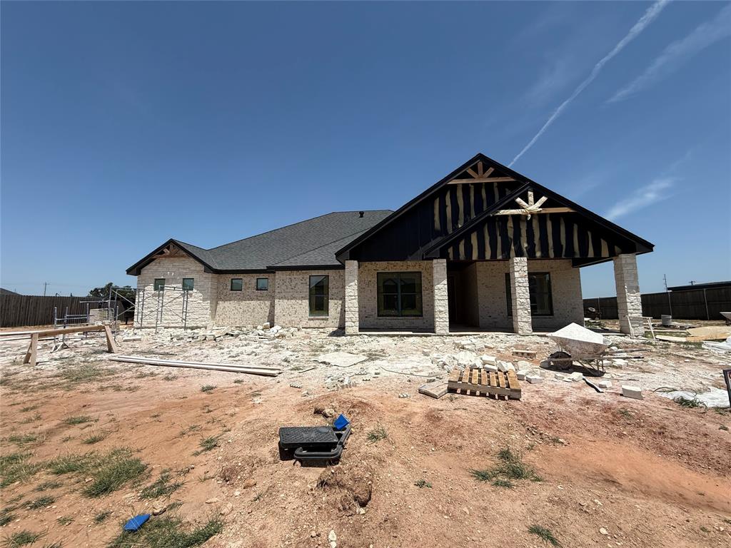 New construction home in a quiet and convenient gated neighborhood. This Wylie West home sits on a cul-de-sac in the South Ridge neighborhood. Positioned on a large lot with an expansive backyard. Large front and back covered patios. 8 Ft. front door with glass panes provides the foyer with natural light. The left hallway leads to 2 spare bedrooms and shared-guest bathroom. Across the foyer is a 4th bedroom with a full private en-suite bathroom. Spacious living room with tall ceilings and gas stone fireplace. Open Kitchen-dining-living area with true wood floors. Tons of kitchen counter and cabinet space. Upgrades GE modern appliances including gas cooktop. Private primary bedroom with en-suite, dual vanities and sinks, large shower, soaking tub and walk-in closet. Private laundry area with ample cabinet space. Over-sized side garage with storage space. Sod, Sprinkler, and fence included. Estimated completion end of July 2026.