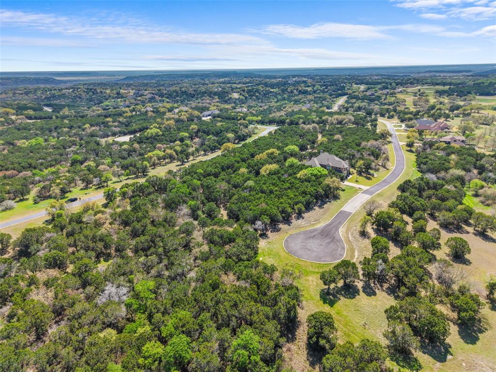 Positioned on a spacious 0.329-acre homesite within a golf course community in Cleburne, this lot offers the kind of setting buyers look for when they want both room to build and a neighborhood that enhances everyday living. The natural landscape, combined with paved roads, spacious lot spacing, and nearby amenities like the golf course and clubhouse, creates an environment that supports both quiet living and an active lifestyle. The setting allows for flexibility in design while maintaining the character and appeal of the neighborhood. Buyers are drawn to this area for its balance of scenic views, community features, and the ability to build something tailored to their needs without feeling confined. This is an opportunity to secure land in a location where lifestyle and long-term value align.