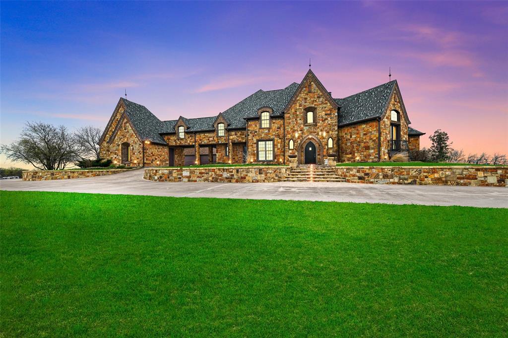 This is a stunning 2-story luxury residence, thoughtfully crafted for comfort and sophistication. Each of the 4 bedrooms in this sanctuary features its own en-suite bathroom and spacious walk-in closet. The custom kitchen features two Sub-Zero fridges, two dishwashers, a butler's pantry, and wine alcove for ease of entertaining. Natural light floods the home through the bay windows and vaulted ceilings, creating a welcoming ambiance. A laundry room on each floor makes household chores a breeze. With a full mother-in-law suite, expansive office, media room, workout room; and exquisite pool surrounded by multiple lounge patios and a full outdoor kitchen. Don't miss the 6-car garage, insulated detached workshop with 6 additional spaces for cars, 4-stall horse barn, hay stall, tack room, cross fenced pastures with water to each. This home is ideal for fun and relaxation. This hilltop home located in a community offers stunning 360 views. A true forever home