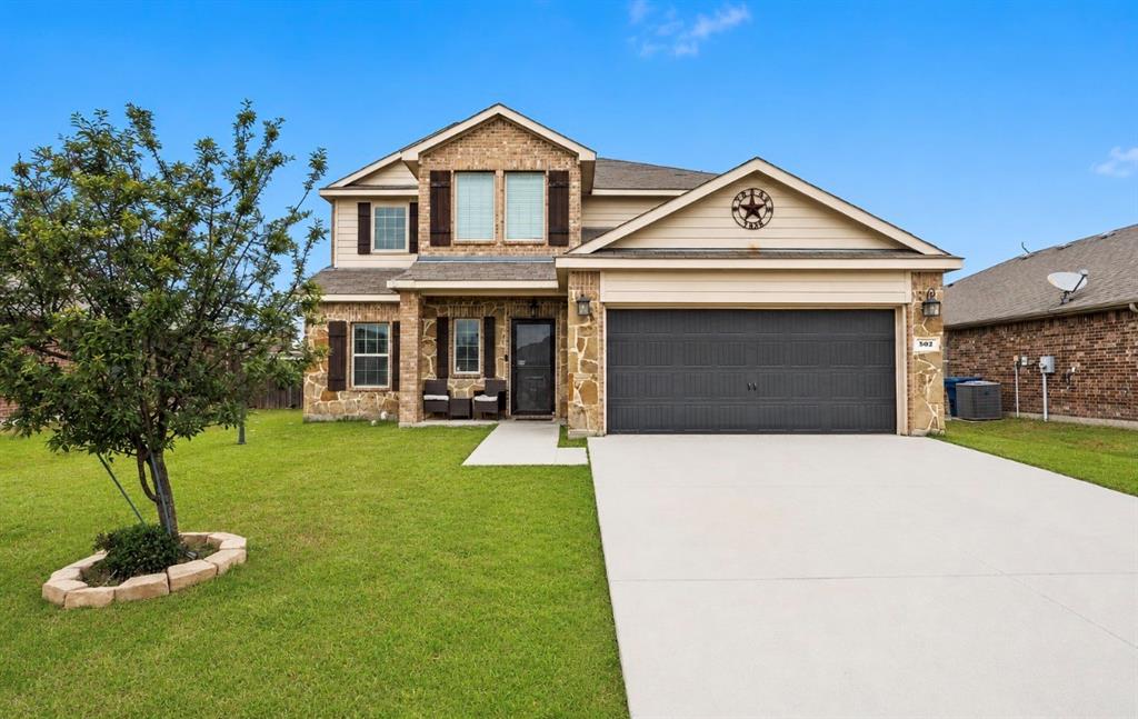 Step inside 502 Hawthorn Drive, a spacious 5-bedroom, 2.5-bathroom home offering 2,598 square feet of comfortable living space in the desirable Fountainview community. This well-designed home features a spacious split-concept floorplan with an open kitchen and living area downstairs, ideal for both everyday living and entertaining. The oversized primary suite includes a sitting area, creating the perfect private retreat. Upstairs offers a secondary living area or flex space, along with four additional bedrooms, all featuring walk-in closets, and a full bathroom. Large laundry room. The backyard is spacious and showcases an extended covered back deck, perfect for relaxing or entertaining outdoors. Conveniently located just minutes from shopping, dining, and easy access to I-30. Additional highlights include NO MUD tax and NO PID tax.