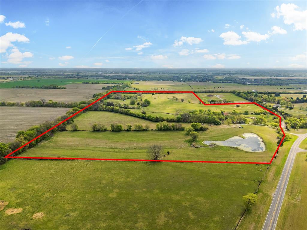 Beautiful 62.2 +or- acres located East of Van Alstyne.  Has 2 ponds, creek, 2 barns and 3 bedrooms, 2 bath farm house.  Surrounded by rolling countryside, this expansive property offers endless possibilities — whether you're looking to build a home, establish a private ranch, or invest in future development. Enjoy this country living with plenty of space to roam, yet remain conveniently located just minutes from downtown Van Alstyne and within easy reach of Hwy 75 for a quick commute to McKinney, Sherman, or the DFW metroplex. With a mix of open pasture and scattered trees, the land provides both beauty and versatility — ideal for custom builds, recreational use, or agricultural pursuits.