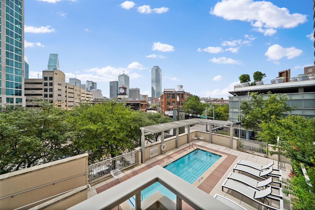 Elevated urban living at The Terrace Condominiums in the heart of Victory Park. Ideally situated within walking distance of the American Airlines Center, Perot Museum, Klyde Warren Park, Katy Trail, premier dining, entertainment, Goldman Sachs, and many opportunities to network, and socialize. Within 10min to uptown, downtown, arts district, and bishop arts. This spacious and thoughtfully designed 2-bedroom, 2-bath residence offers 10-foot ceilings, hardwood flooring, expansive windows with dual-layer shades, and abundant natural light throughout. The updated kitchen features sleek flat-panel cabinetry, granite countertops, stainless steel appliances, and a Samsung refrigerator. Recent improvements include a new HVAC 2025. Step outside to your private terrace overlooking the resort-style pool and vibrant Victory Park, providing the perfect setting to relax or entertain. Residents enjoy exceptional HOA amenities including concierge service, 24-hour security, a fully equipped fitness center, social lounge, heated pool with amenity deck and outdoor fireplace, and two assigned spaces in the gated parking garage.
