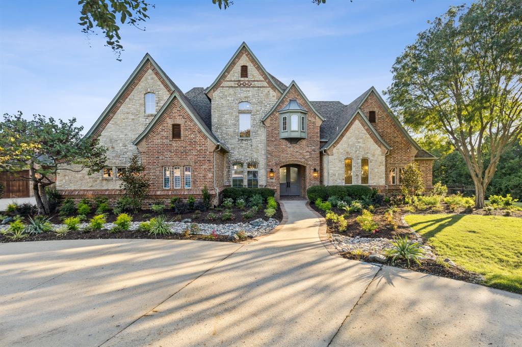 Prestigious Whispering Farms set on 2.3 acres in a quiet cul-de-sac creek lot. It’s a country retreat without sacrificing the convenience of city amenities. Inside your home, enjoy living on a grand scale with generous room sizes, wood floors, hand-trowelled walls, & designer finishes. The great room, kitchen, and dining areas are open to one another, promoting conversation and togetherness. Unobstructed views to the back of your home open to gorgeous outdoor living that extends your floor plan with seating, dining, and a summer kitchen. Your pool sparkles against thoughtful landscaping that provides beauty and privacy. The back of the property has a baseball or softball field. Situated in the top-rated Prosper school district, this home has everything you need for spacious, serene living. This custom home was built by Kleber Custom Homes.