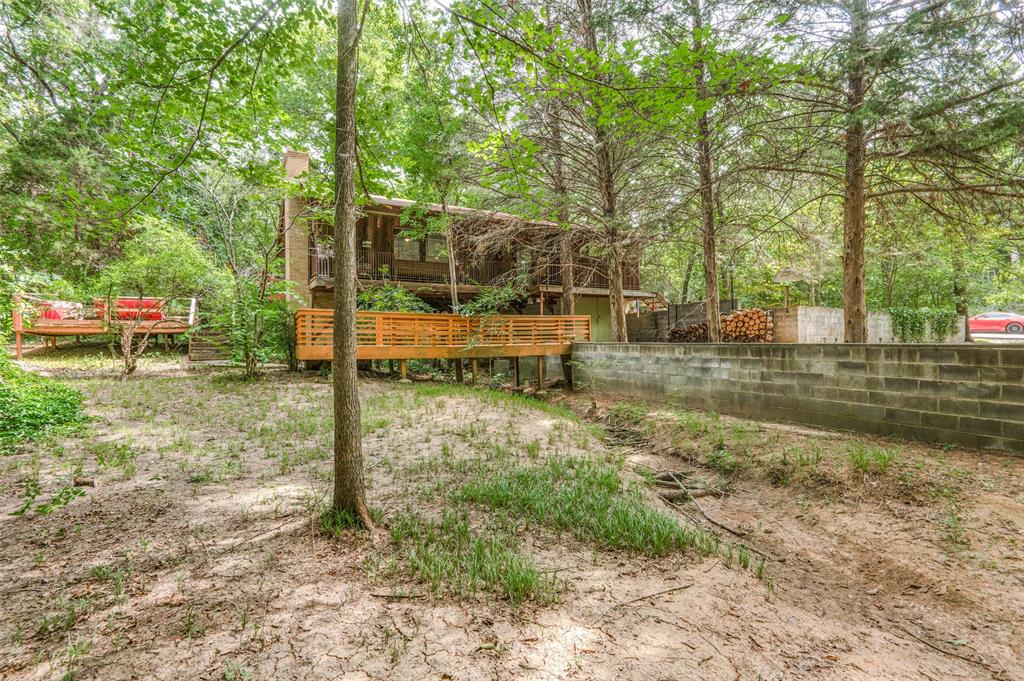 Tired of the noise in the big city? Miss seeing the stars at night? Like waking up to the sounds of birds chirping and wildlife? We have a GET AWAY place for you! The cedar cabin on stilts straddles over a creek bed & is surrounded by trees on 3 sides. There are two decks for entertaining, a long front porch for bird watching and a fireplace to keep you warm as you roast marshmallows. Recently updated bath and living area with hardwood floors through out. The GET AWAY is in a subdivision with a POA that gives you access to the gated boat dock and picnic area. 

The subdivision does allow short term rentals.