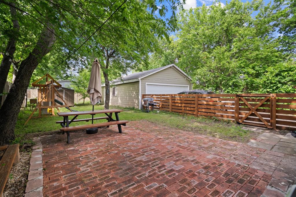 Beautifully updated home in the heart of North Oak Cliff, just minutes from Bishop Arts District (approx. 10 minutes) and Wynnewood Village (approx. 5–7 minutes), offering easy access to some of Dallas’ best shopping, dining, and entertainment.

Inside, you’ll find two spacious living areas—perfect for entertaining, working from home, or flexible everyday living. The primary suite features a private en-suite bath, and the home offers no carpet throughout for a clean, modern feel.

Step outside to a large backyard with plenty of space to relax, entertain, or create your ideal outdoor setup. The massive detached garage provides exceptional storage and includes additional space behind it—perfect for a workshop, home gym, office, or potential guest suite or income-producing conversion.

A rare opportunity to own a versatile property with space, functionality, and an unbeatable location near the best of Oak Cliff living.
Click the Virtual Tour link to view the 3D walkthrough. Discounted rate options and no lender fee future refinancing may be available for qualified buyers of this home.