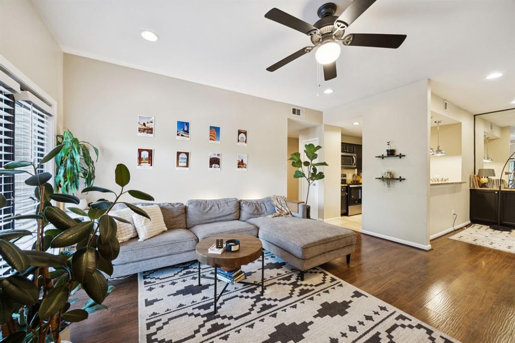 Welcome to 8601 Park Lane #726, Dallas, TX – an updated 1-bedroom, 1-bath condo offering comfort, functionality, and modern charm in a gated community with lush surroundings and resort-style amenities. Step inside to discover a bright, open-concept living area featuring warm wood-look flooring and a neutral color palette that creates a clean and modern feel. The cozy living room with a fireplace offers a perfect place to relax or entertain and opens to a private balcony that faces the community pool—ideal for morning coffee or evening wind-downs. The kitchen boasts sleek black cabinetry, granite countertops, and stainless steel appliances, along with a breakfast bar and pendant lighting for casual dining or entertaining. Just off the kitchen is a bonus flex space with built-in cabinetry and a mirrored wall, perfect for a home office, creative nook, or formal dining area. The spacious bedroom offers great natural light, vaulted ceilings, and access to the private balcony. The updated bathroom includes granite countertops, a large vanity, and a beautifully tiled shower-tub combo with inset shelving. This gated community includes access to a sparkling pool, hot tub, and beautiful green spaces surrounded by mature trees—perfect for relaxing weekends or entertaining guests. Located minutes from NorthPark Center, Top Golf, SMU, and major highways, this condo provides the best of both privacy and convenience in North Dallas.