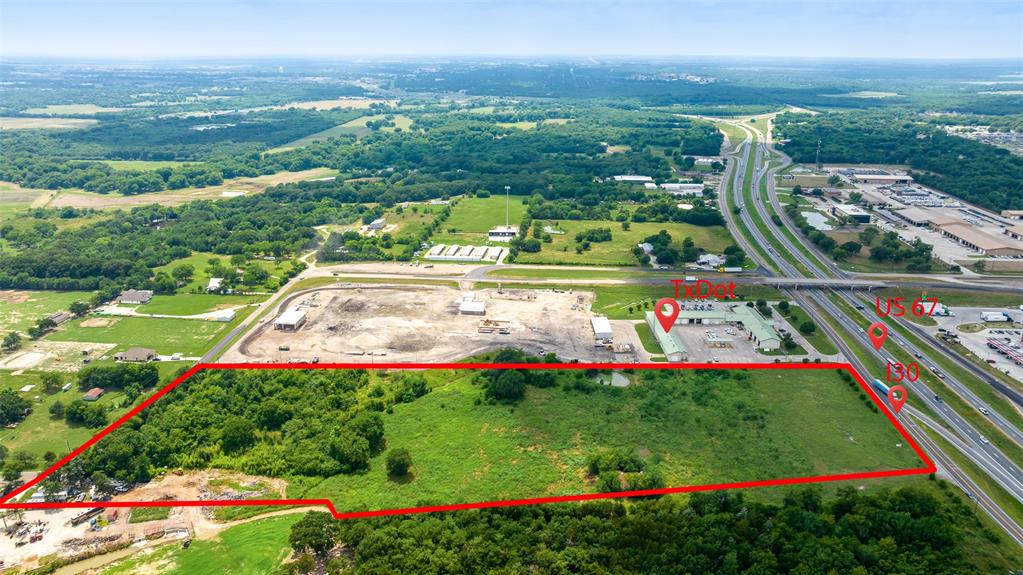 16+ Acres of Unrestricted County land with direct Intestate 30 access in Greenville, Texas. Most sought after commercial land! Less than hour from downtown Dallas. Close proximity to shopping, restaurants, grocery, hospitals and more! This property could be suitable development for any commercial type business, including industrial as there are NO KNOWN RESTRICTIONS. 7.1 Acres property is within city limits, however 9.1 Acres is outside of Greenville City limits and falls under Hunt County which has no zoning for this property, so your own imagination is what can be done here. This property would be perfect for any commercial venture, ideally a huge income generating truck stop & gas station. Also, a storage unit facility or RV Park can be built with tons of nature in the back. Great one time business opportunity, don't miss it!
