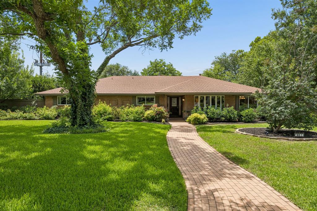 Nestled in the heart of Northaven Park, this stunning ranch-style home offers an exceptional and versatile floorplan, thoughtful updates, and inviting outdoor living spaces. Beautiful curb appeal, enhanced by extensive landscaping, creates a sense of privacy and tranquility while making a memorable first impression. Step inside and instantly feel at home. The welcoming living room features a beautiful bay window and flows seamlessly into the dining room, both offering picturesque views of the lush front yard. A truly unique and spacious butler’s pantry provides abundant storage and serves as the perfect extension of the home for entertaining. At the center of it all, the open kitchen features quartz countertops, a breakfast bar, gas cooktop, and easy connection to the surrounding living spaces. Just off the kitchen, a dedicated office provides the ideal work-from-home setup, while the oversized laundry room offers exceptional storage and hanging space. A conveniently located powder bath adds even more functionality. The expansive family room is a standout, featuring vaulted ceilings, a wall of windows overlooking the patio, and a beautiful painted brick gas fireplace. An additional seating area creates the perfect spot to relax, gather, or unwind, while a nearby powder bath is ideal for guests.
Four generously sized bedrooms and two spacious full bathrooms provide room for everyone. The private primary suite features two walk-in closets and an ensuite bath complete with dual sinks, a soaking tub, and a separate glass-enclosed shower. Ideally located just moments from the popular Northaven Trail, zoned to Withers Elementary School, and convenient to many of Dallas’ premier private schools, this home offers the perfect blend of comfort, character, and location in one of North Dallas’ most beloved neighborhoods. Don't miss the opportunity to make it your own.