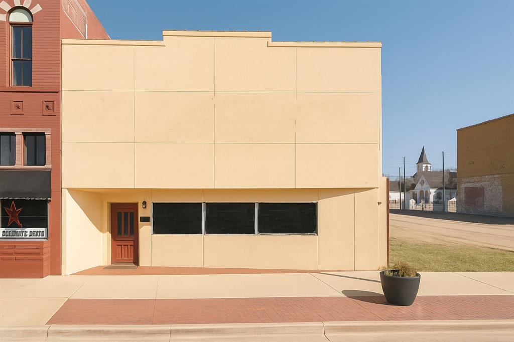 For Sale in the Highly Desirable Historic Downtown Cleburne District

Located directly on the vibrant Cleburne Square, this 2,403 sq ft commercial storefront offers exceptional visibility, classic 1900s character, and a flexible layout suited for a wide range of business uses. Situated in the heart of Historic Downtown Cleburne, the property benefits from steady foot traffic, surrounding restaurants and retail, and strong community activity year round.

The interior features a spacious front lobby and waiting area, a defined reception and checkout space, six private offices or treatment rooms of varying sizes, two restrooms, a kitchen and break room, a utility room, and dedicated storage. The layout is ideal for businesses that require multiple private rooms or service areas while still offering an inviting customer facing presence.

Potential uses include salon suites, esthetician or lash studios, massage therapy, wellness centers, tattoo and piercing studios, boutique med spa services, therapy or counseling offices, chiropractic or acupuncture practices, small medical offices, photography studios, creative or design offices, and boutique retail concepts.

With its clean interior flow, welcoming storefront entrance, and prime location on the Square, this building presents an excellent opportunity for an owner user to establish a flagship location or for an investor seeking a well positioned downtown commercial asset.

This is a rare opportunity to own a piece of Historic Downtown Cleburne with strong visibility, walkability, and long term upside in one of the most active commercial corridors in the area.