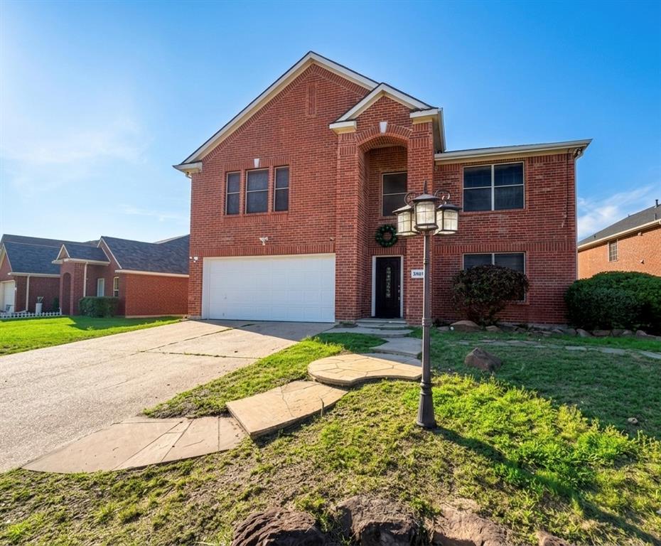Welcome to 7405 Lake Whitney Dr., located in the highly sought-after Mansfield ISD! Set on an OVERSIZED lot, this home features a rare OPEN FRONT VIEW with no direct neighbors across the street, providing added privacy, convenient guest parking, and scenic seasonal views of a bluebonnet field. From the front yard, you can also enjoy seasonal fireworks from both Joe Pool Lake and Hawaiian Falls.

The charming curb appeal is highlighted by a TIMELESS red brick exterior, covered entry, stone walkway, decorative lamppost, and a beautiful oasis-style garden. Inside, the bright open-concept layout is filled with natural light and enhanced by neutral designer finishes and comfortable living spaces that flow seamlessly throughout.

The kitchen is a chef’s dream, featuring sparkling GRANITE countertops, white cabinetry, STAINLESS STEEL appliances, and a spacious center island ideal for meal prep and casual dining.

The primary suite offers a peaceful retreat with real hardwood flooring, dual vanities, a JETTED soaking tub, separate shower, and an oversized walk-in closet.

Step outside to an expansive backyard with a large CONCRETE PATIO—perfect for entertaining, family gatherings, and sports practice. There are an additional included shed and a workshop provide excellent storage and workspace for tools, hobbies, and outdoor equipment.

This home conveniently located just minutes from Highway 360, offers quick access to shopping, dining, entertainment, and major employment hubs throughout the Metroplex. Don’t miss this rare opportunity to own a home with space, comfort, and versatility for everyone and everything!