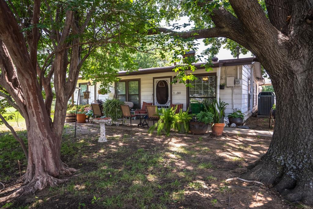 Charming Home with Commercial Zoning in Historic Downtown!  1 block from the new ACE Hardware.

Nestled on a generous .69-acre lot in the heart of historic downtown, this unique property offers incredible flexibility with commercial zoning—perfect for a live or work setup, office space, boutique business, or continued residential use. Surrounded by mature trees and lush greenery, it feels like a private retreat while still offering ample parking for clients, guests, or tenants.

The oversized detached garage provides exceptional storage or workshop space, and the recently upgraded HVAC system ensures year-round comfort in the living areas. Whether you're looking to establish a business in a high-visibility location or simply enjoy the character of downtown living, this property blends charm, convenience, and opportunity.

Don’t miss your chance to own a piece of history with endless potential!   zoned c 3 with an I 35 overlay