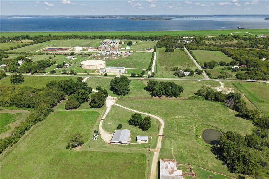 Exceptional opportunity to own 74± acres just minutes from Lake Ray Roberts, ideal for a private ranch, family retreat, or income-producing property. The land is fully fenced and cross-fenced, with pecan trees, established hay production, and facilities for cattle and horses, including a roping arena and implement barn.

There are three residences on the property:

3 bed, 2 bath mobile home 840 sq ft with covered parking

3 bed, 2 bath stucco home 2090  sq ft with separate entry drive,

tiny home with full bath and kitchen, perfect for guests, rental, or office use

Multiple build sites offer stunning sunset views, making this property ideal for creating your dream home or expanding your rural estate. Located in close proximity to Lake Ray Roberts, with easy access to recreation, fishing, boating, and major roadways.

This is a rare chance to own a productive, multi-use property with space for family, livestock, and more. Buyer Agents, please be prepared to provide buyer proof of funds and or lender pre-qualification prior to scheduling an appointment. List Agent present for all showings.