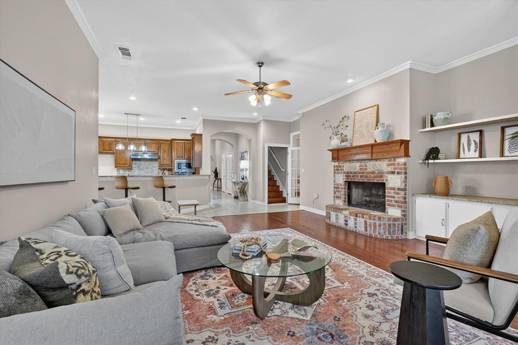 Opportunity knocks with this beautiful property in Deerfield Estates!  Spacious and beautifully designed, this stunning home sits on a generous half-acre lot and offers the perfect blend of comfort, style, and functionality. Inside, you’ll find rich wood floors, soaring high ceilings, and an inviting layout featuring two spacious living areas, an office,  and two dining spaces—ideal for both everyday living and entertaining.  This amazing floorplan features 4 spacious bedrooms downstairs and one HUGE secondary bedroom upstairs.  Two bedrooms are coupled with an additional living area, which makes a perfect game room, gym, or study.

The thoughtfully updated kitchen boasts additional custom cabinetry, providing exceptional storage and workspace for cooking and gathering. Upstairs, a large fifth bedroom offers incredible flexibility for a guest suite, game room, media room, or home office.

Step outside to your private backyard retreat featuring a beautiful pool and plenty of room to relax, entertain, and enjoy the expansive outdoor space. The half acre lot is covered with lush St Augustine grass, has a separate fenced side yard, and an abundance of space for kids and pets.  The gorgeous pool with waterfall is the centerpiece of the backyard and will be the backdrop of countless memories with family and friends!

Roof replaced 2020 with Class 4 shingles, ACs replaced 2018 and 2026.
