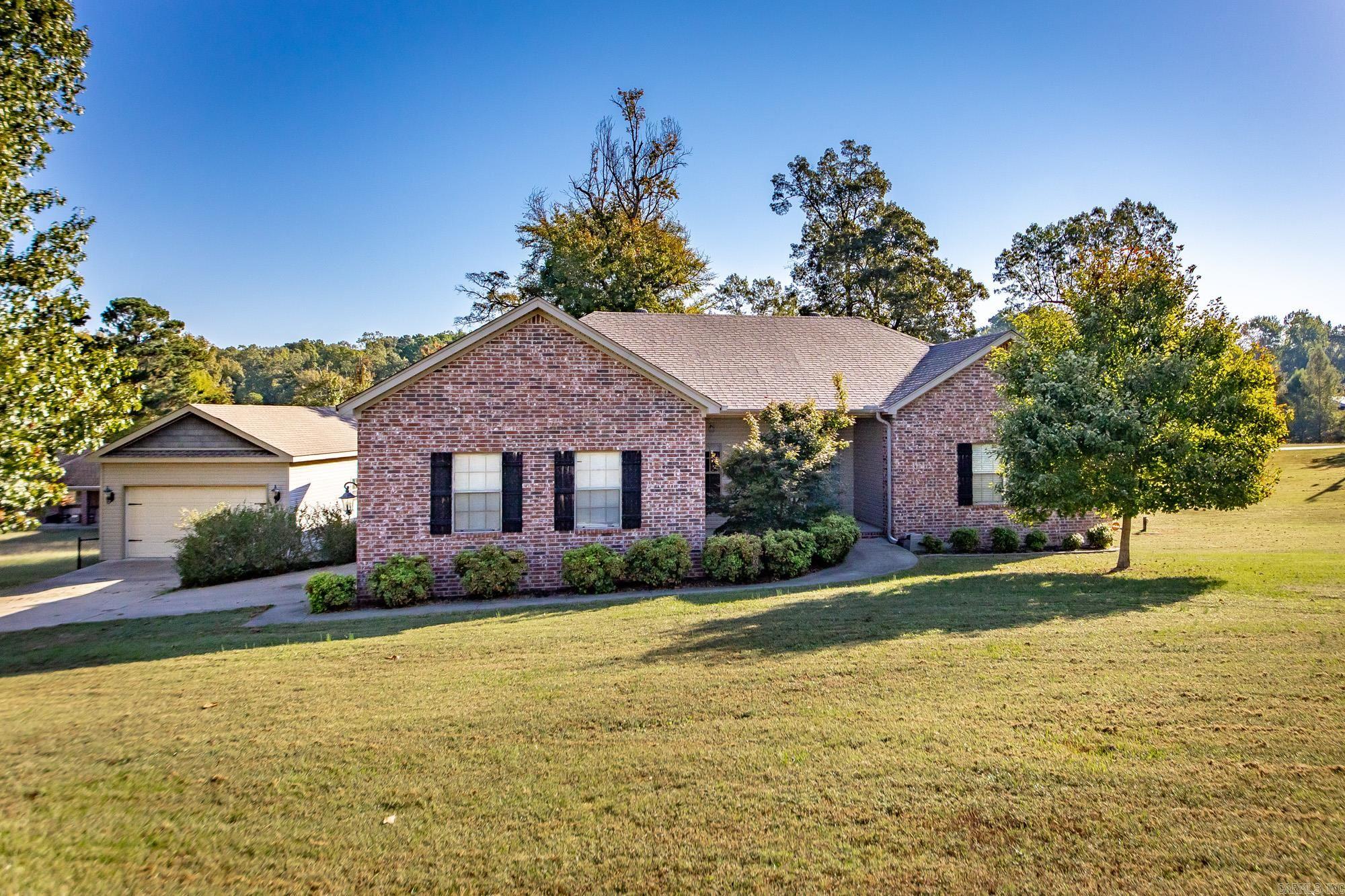 Welcome to 854 Salem Heights Drive — a stunning Benton home that blends charm, comfort, and functionality in one beautiful package. Tucked away in a quiet and desirable area just minutes from I-30, this property offers the perfect balance of privacy and convenience. Step inside to find spacious living areas filled with natural light, neutral tones, and thoughtful finishes throughout. The large living room provides the perfect gathering space, flowing seamlessly into a welcoming kitchen and dining area designed for everyday living and entertaining. The primary suite offers generous space and comfort with ample closet storage and a relaxing ensuite bath. Step outside to enjoy one of this home’s standout features — a huge back deck ideal for entertaining, grilling, or simply relaxing while overlooking the private backyard. The property also includes a detached garage/workshop, offering the perfect setup for storage, hobbies, or additional parking. The outdoor space provides room to play, garden, or unwind in peace. With its curb appeal, functional layout, and unbeatable location near shopping, dining, and Benton schools, this home is truly move-in ready and full of potential.