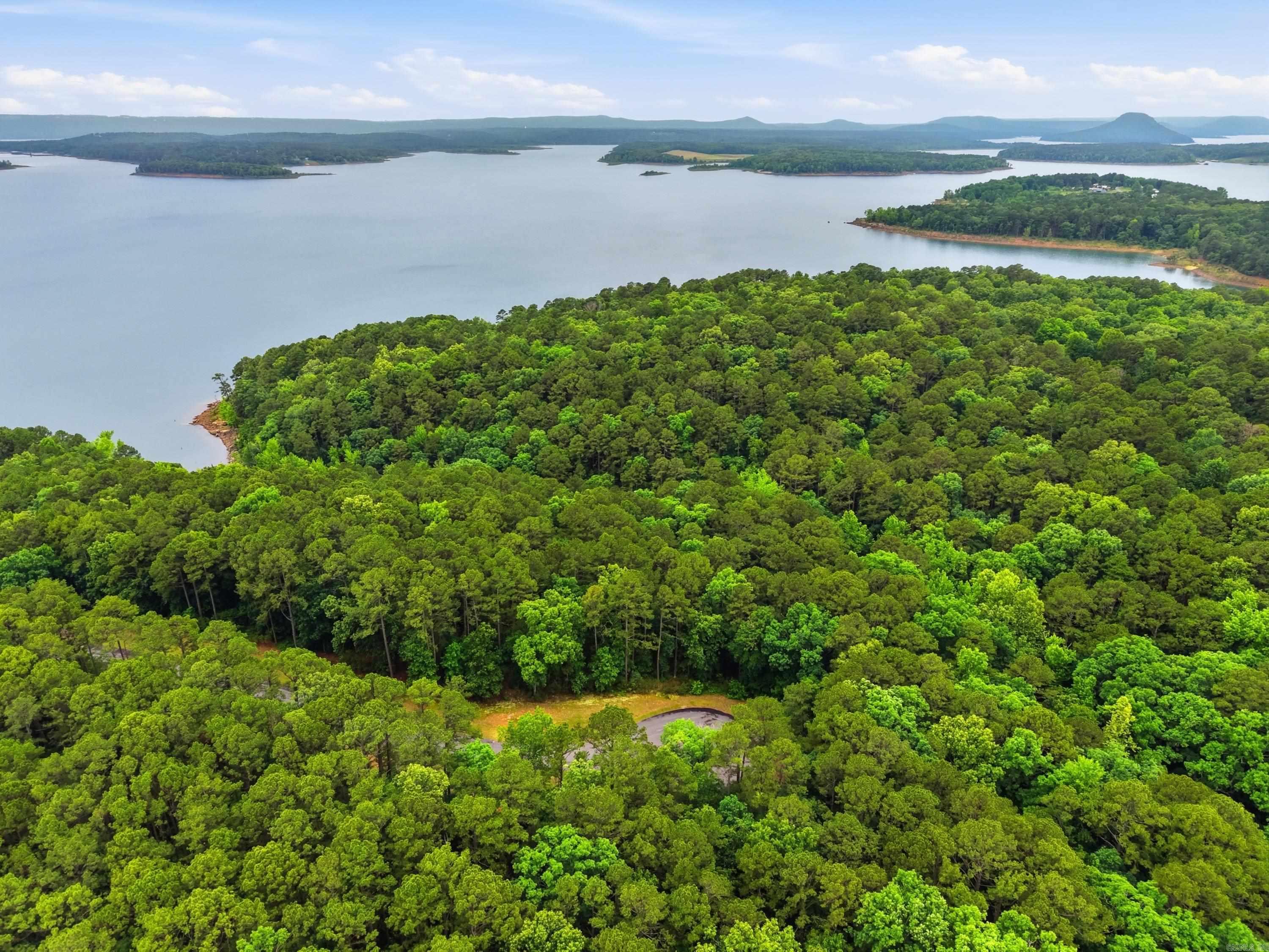 Experience premier lakefront living in Edgewater Subdivision in Edgemont, Arkansas! These exceptional waterfront lots on Greers Ferry Lake offer the rare opportunity to build directly along the shoreline in one of the area’s most sought-after lake communities. Enjoy breathtaking water views, peaceful surroundings, and direct access to all the lake activities you love including boating, fishing, kayaking, and swimming. Whether you are planning a luxury lake home or vacation retreat these lakefront lots provide the perfect setting to create your ideal getaway. Conveniently located near marinas, restaurants, and Fairfield Bay amenities while still offering the privacy and serenity of lakeside living. Utilities available at the road. Come enjoy the beauty and lifestyle that Greers Ferry Lake has to offer!